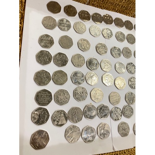 169 - A quantity of 50 pence pieces to include Beatrix Potter, Olympic Games and other themes. x76 coins.