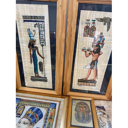 132 - Group of Egypitian themed art  consisiting x2 tall rectangular framed Egyptian  figures on papaya, 3... 