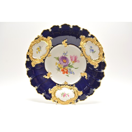 25 - 20th Century Meissen plate decorated with flower stems and floral bouquets, cobolt blue with gilt de... 