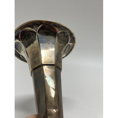 44 - Silver Interest - A silver trumpet vase together with cut glass salt and peppers,  Peperette, and sp... 