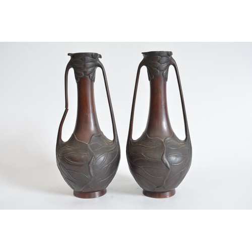 51 - Pair of Art Nouveau twin handled vases, with floral and leaf decoration a/f to 1 handle. max height ... 