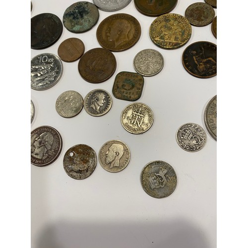 79 - Vintage small tin containing a mixture of English and coins from around the world to include medalli... 