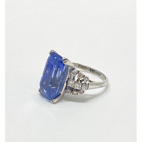 93 - Tanzanite and diamond dress ring,  Very large rectangular-cut central stone with three rows of damon...