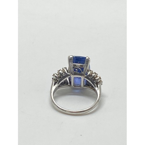 93 - Tanzanite and diamond dress ring,  Very large rectangular-cut central stone with three rows of damon... 