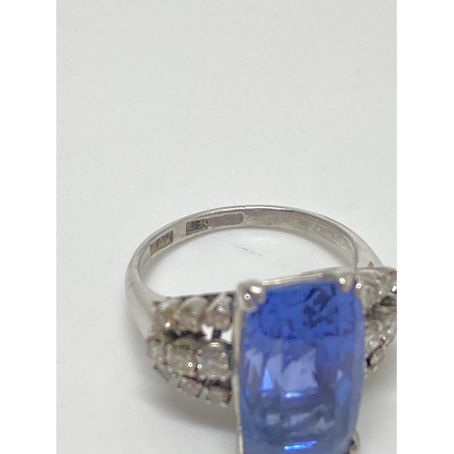 93 - Tanzanite and diamond dress ring,  Very large rectangular-cut central stone with three rows of damon... 