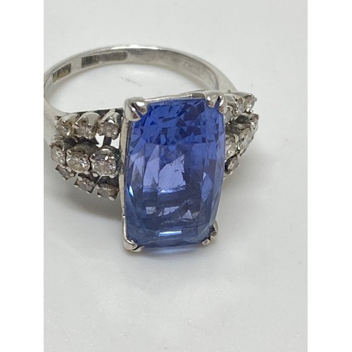 93 - Tanzanite and diamond dress ring,  Very large rectangular-cut central stone with three rows of damon... 