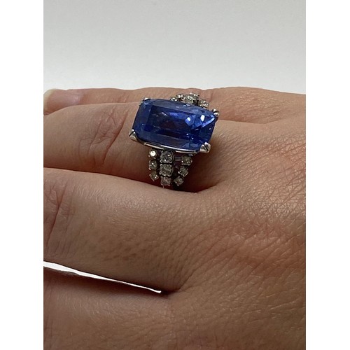 93 - Tanzanite and diamond dress ring,  Very large rectangular-cut central stone with three rows of damon... 