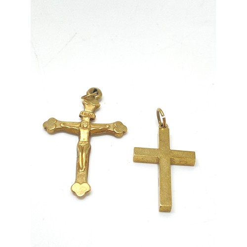 99 - 9ct gold cross pendant, hallmarked 375. weight 4g and one other pendant.