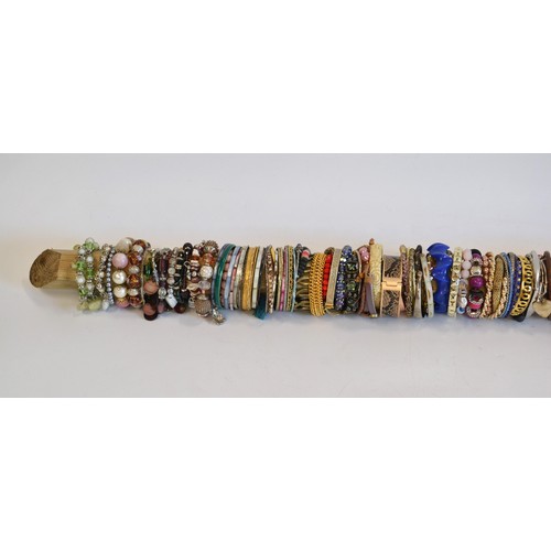 109 - Costume Jewellery collection of  bracelets in  various colours and designs and in excess of 120, [st... 