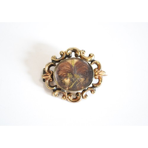 112 - Victorian mourning pin brooch with intracately woven hair encapsulated front and back, believed to b... 