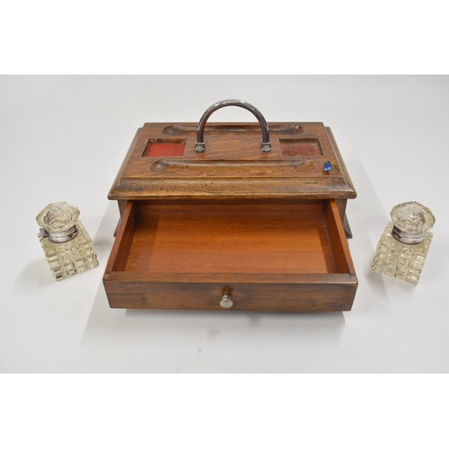 142 - Antique wooden stationery box/desk piece with cut glass inkwells, lower drawer.