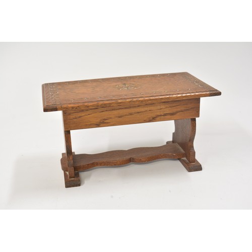 145 - Oak music box in the design of a refectory table, approx size 27 x 14cm.