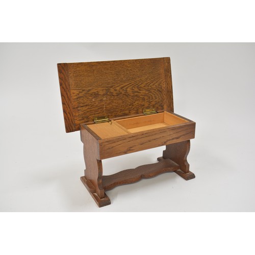 145 - Oak music box in the design of a refectory table, approx size 27 x 14cm.