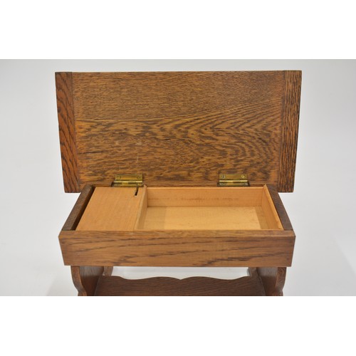 145 - Oak music box in the design of a refectory table, approx size 27 x 14cm.