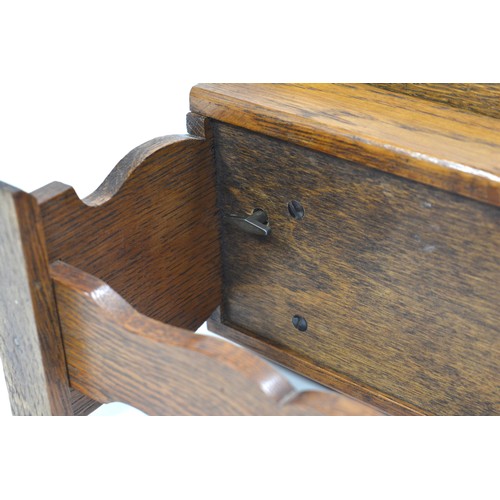 145 - Oak music box in the design of a refectory table, approx size 27 x 14cm.