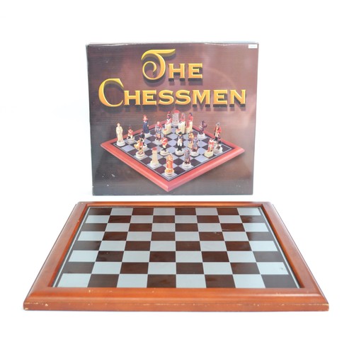 151 - A group of chess Boards/Pieces and boxed Dominos to include folding round chess board housing terrac... 