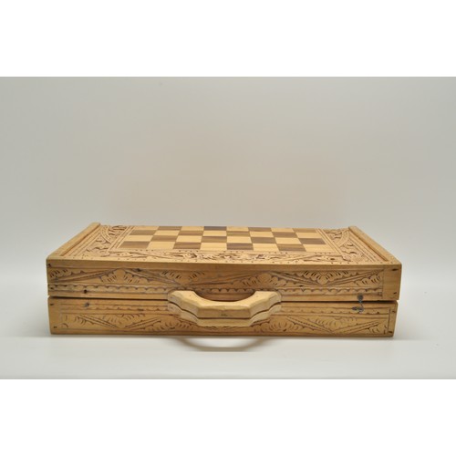 153 - Wooden chess board with carved backgammon / chess pieces in Russian doll design.