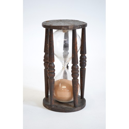 158 - Antique hour glass Timer, hand blown with  hand turned oak cage, size is approx 22 cms tall