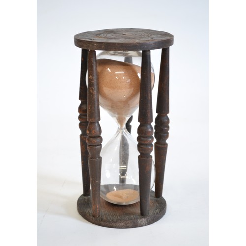 158 - Antique hour glass Timer, hand blown with  hand turned oak cage, size is approx 22 cms tall