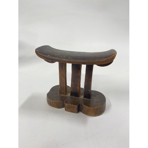 159 - Treen items consisting of a small antique tribal headrest together with a miniature apprentice style... 