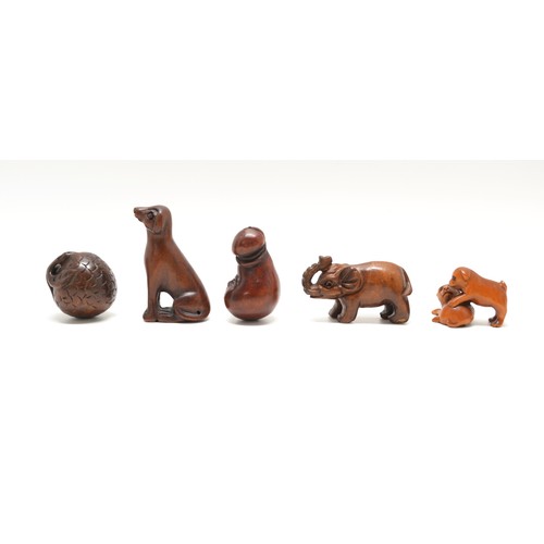 166 - x 5 dark hardwood Netsukes, consisting of an unusual face, a Dog, an Elephant, two puppies (signed) ... 