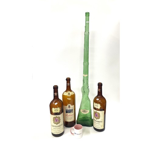 172 - Oversized vintage wine bottles (x3) plus a large green glass bottle in the form of a rifle. Ideal fo... 