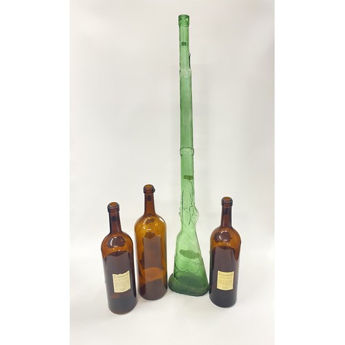 172 - Oversized vintage wine bottles (x3) plus a large green glass bottle in the form of a rifle. Ideal fo... 