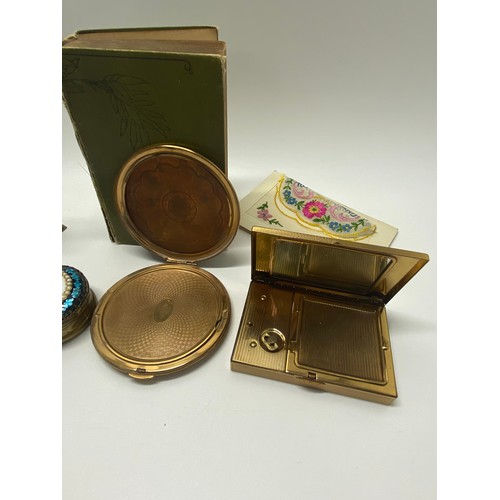 179 - Various holders containing a collection of vintage and antique hat pins together with compacts etc.