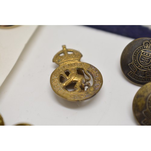 207 - A collection of various military buttons and cloth badges , the buttons include Royal Navy and Royal... 