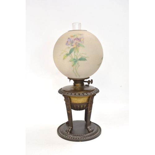 215 - Oil lamp with sand blast effect glass globe shade with flag iris/ flower design, shade is signed, st... 