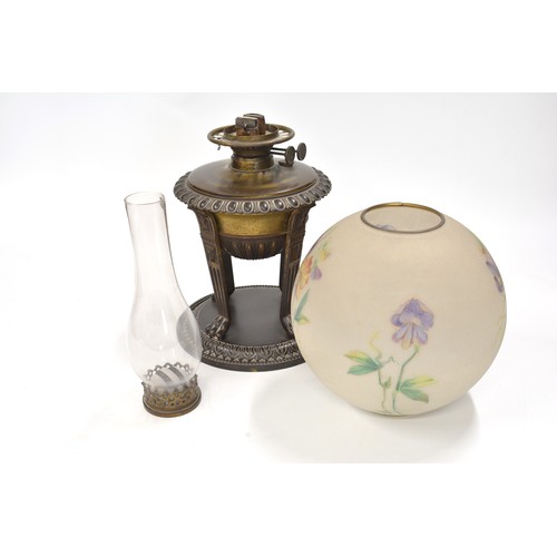 215 - Oil lamp with sand blast effect glass globe shade with flag iris/ flower design, shade is signed, st... 