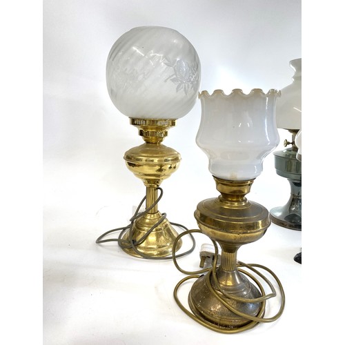 218 - Vintage lamps x4 to include 2 oil lamps complete with shades & Funnels  and 2 brass effect lamps con... 