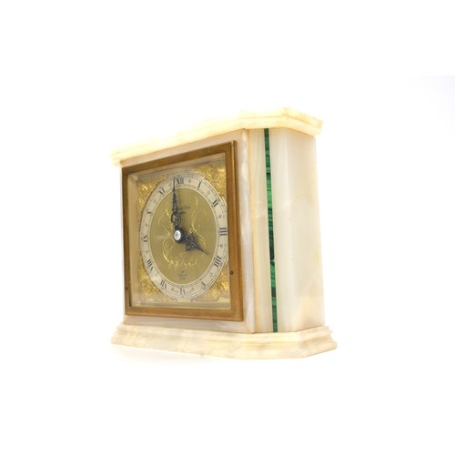 225 - Art Deco Elliott Mantle Clock contained in a White Onyx Case with Malachite stripping, 14cms high. S... 