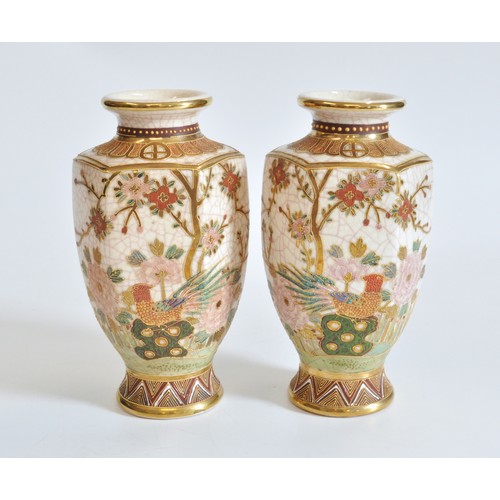 231 - A pair of oriental crackle glazed vases, with peacocks and flower designs, stamp to base. Approx H23... 