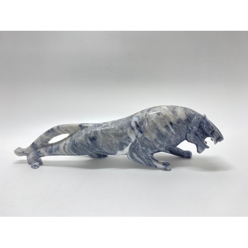 237 - A grey and white stone figure of a growling Jaguar
 L:29cm H:8.5cm approx