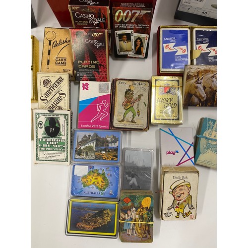 242 - A large quantity of collectable vintage and early 20th Century playing cards and card games includin... 