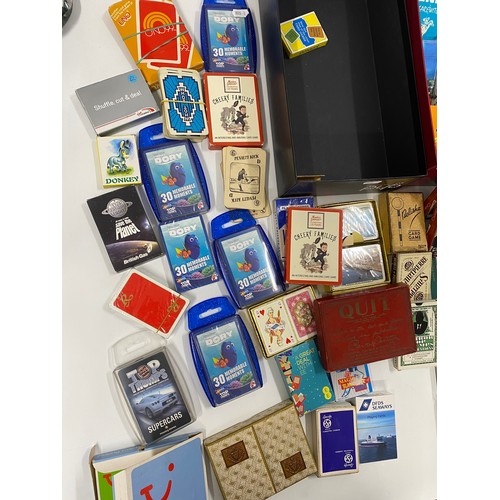 242 - A large quantity of collectable vintage and early 20th Century playing cards and card games includin... 