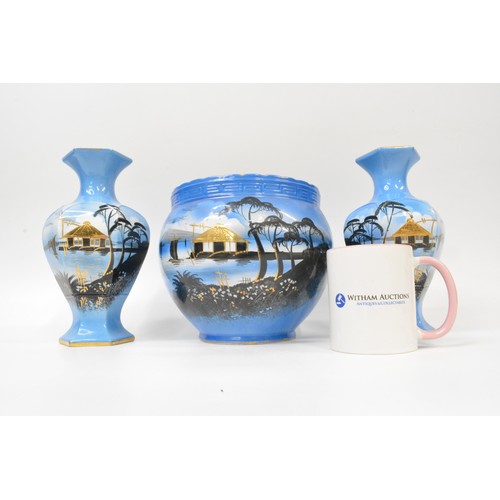 18 - Oriental themed pottery with gilding consisting pair of vases and jardinere