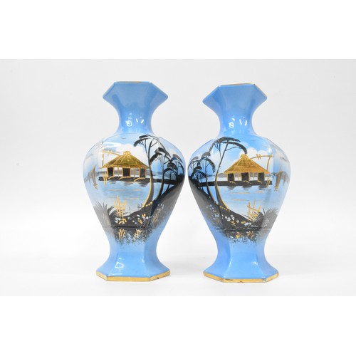 18 - Oriental themed pottery with gilding consisting pair of vases and jardinere