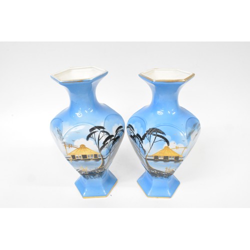 18 - Oriental themed pottery with gilding consisting pair of vases and jardinere