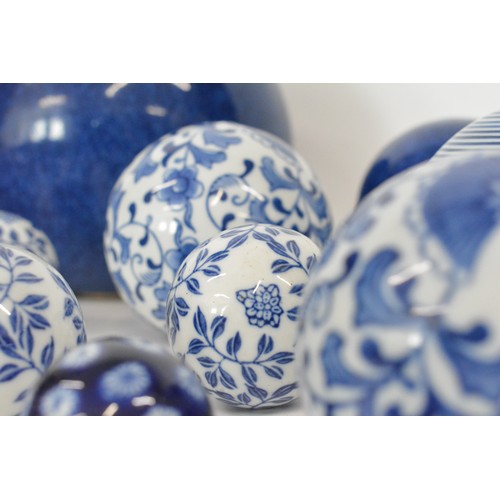 31 - Various selection of  ceramic spheres, bowls , blue and white, approx sizes 19cms largest and 4 cms ... 