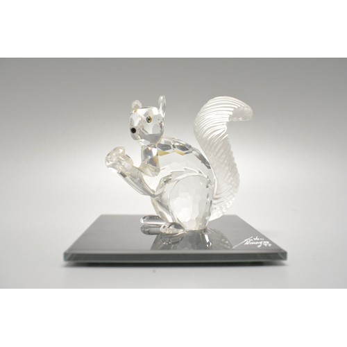 37 - An assortment of Swarovski crystal ornaments, to include 10th anniversary 1997 squirrel on designer ... 