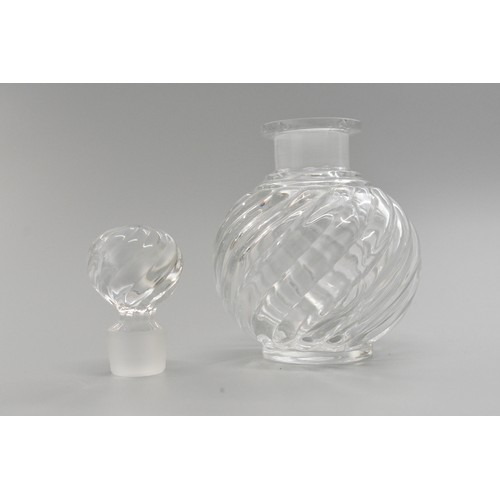 38 - Baccarat swirl design glass perfume bottle, height 11cms high with markings to base of bottle and ba... 