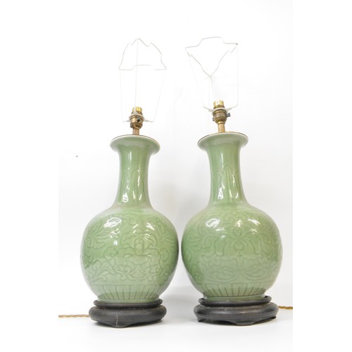 54 - Pair of vintage  green ceramic lamps on wooden base,  approx height 64cms, PAT tested.