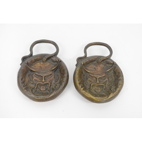 72 - A pair of vintage chinese brass dishes featuring a raised sculptured male face of a chinese man from... 