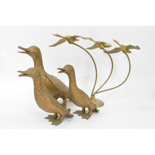 77 - A group of brassware items to include flying ducks, ducks, fairground rocking horse, etc