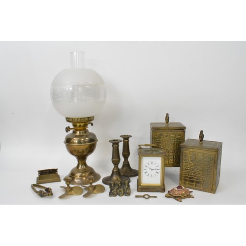 79 - A pair of vintage brass tea caddies,  brass oil lamp with glass shade and funnel, pair of candlestic... 