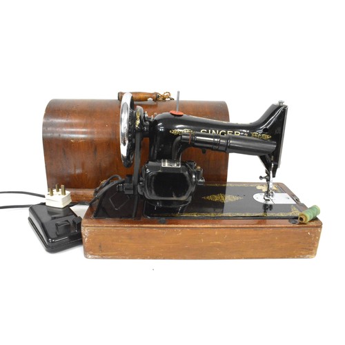 119 - Vintage cased Electric Singer sewing machine with pedal , working at time of cataloguing and has a  ... 