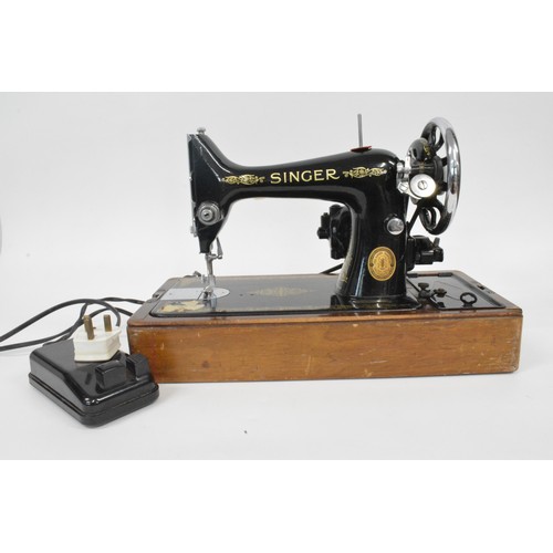 119 - Vintage cased Electric Singer sewing machine with pedal , working at time of cataloguing and has a  ... 