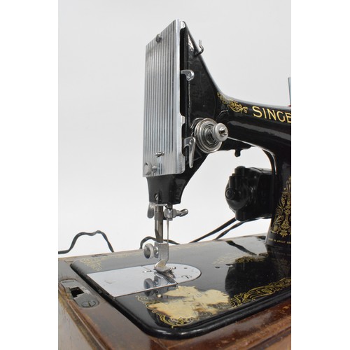 119 - Vintage cased Electric Singer sewing machine with pedal , working at time of cataloguing and has a  ... 